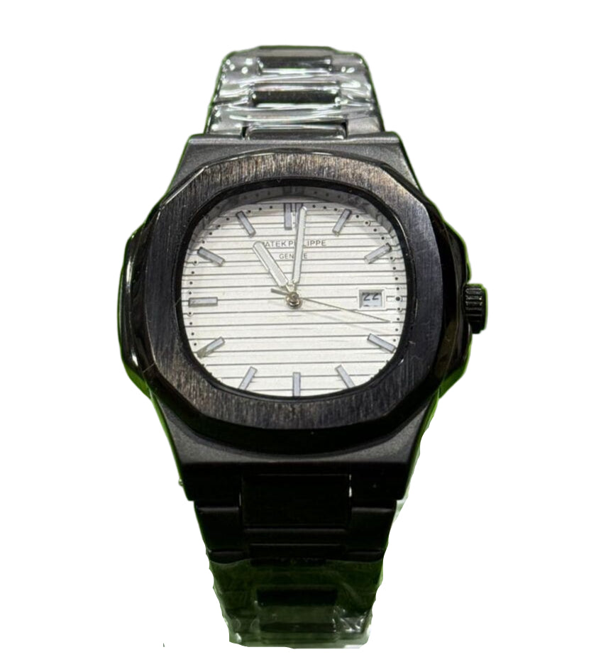 Black watch with a white face on a green grass background