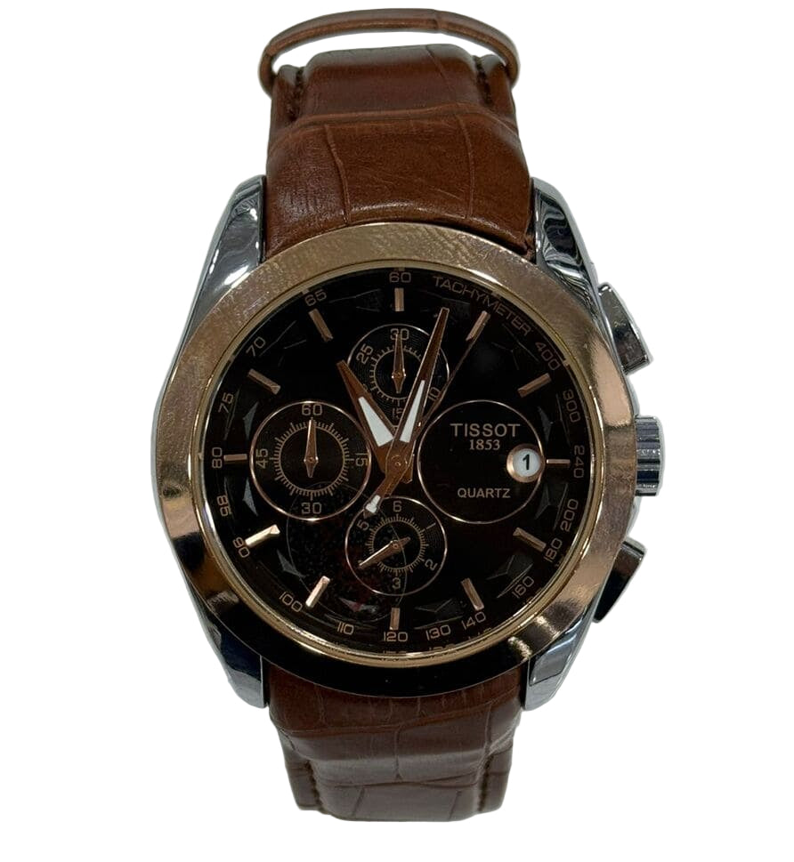Tissot watch with brown leather strap on a white background